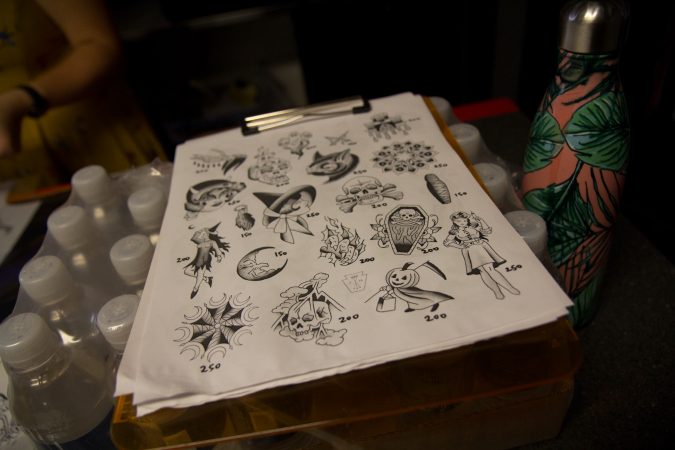 Tattoo options for the Friday the 13th free tattoo give away at Eastern State Penitentiary. (Kimberly Paynter/WHYY)