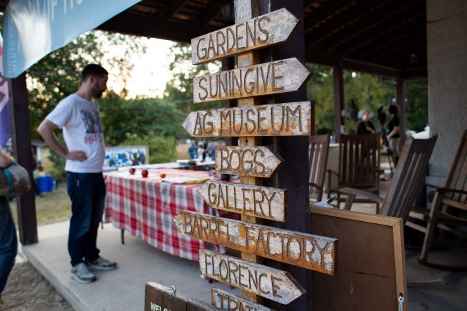 Signs at the Whitesbog General store point visitors to different points of interest. (Becca Haydu for WHYY)