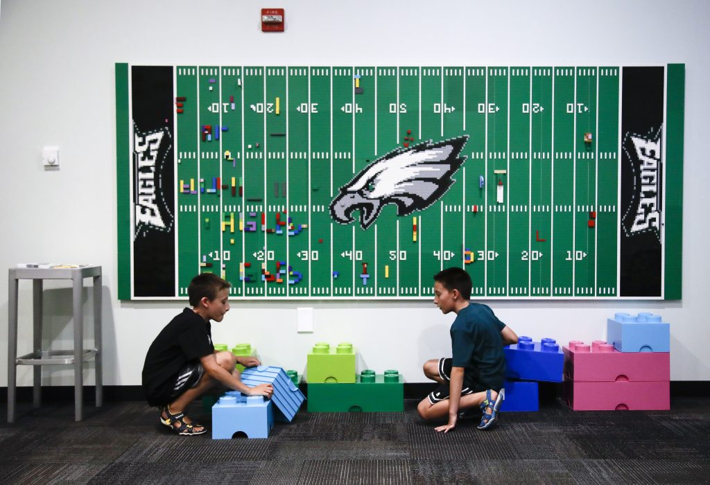 In this Thursday, Aug. 22, 2019, photo, 10-year-old twin brothers Ryan left, and Jack Ykoruk, play in the Lincoln Financial Field sensory room before a preseason NFL football game between the Philadelphia Eagles and the Baltimore Ravens in Philadelphia. (Matt Rourke/AP Photo)