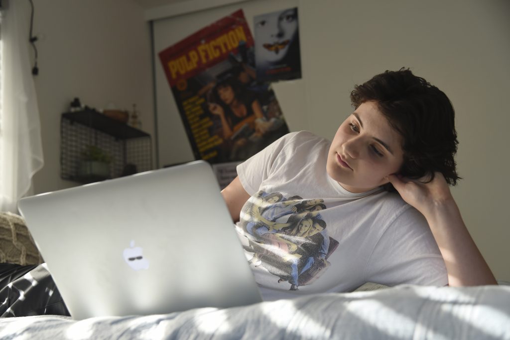 Esme Goldman In this Thursday, Aug. 22, 2019 photo, Esme Goldman, 13, streams an episode of the '90s sitcom