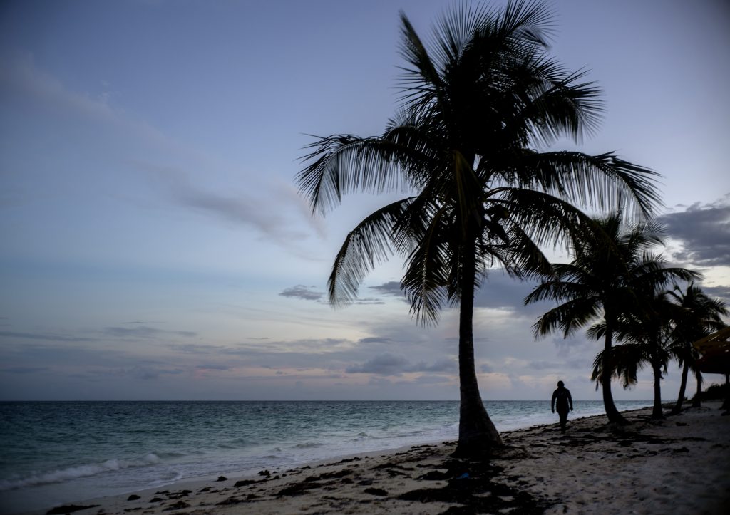 Bahamas Tropical Weather A woman walks along a beach before the arrival of Hurricane Dorian in Freeport, Grand Bahama, Bahamas, Saturday Aug. 31, 2019. Hurricane Dorian is closing in on the northern Bahamas, threatening to batter the normally idyllic islands with fierce winds, pounding waves and torrential rain. (Ramon Espinosa/AP Photo)