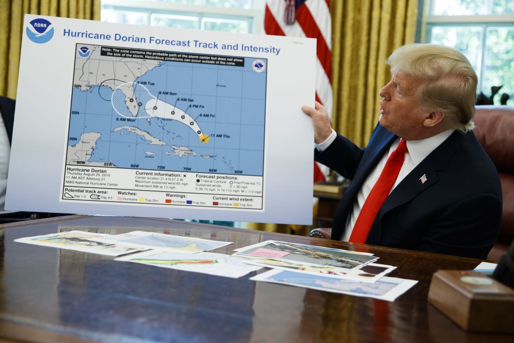 Donald Trump President Donald Trump holds a chart as he talks with reporters after receiving a briefing on Hurricane Dorian in the Oval Office of the White House, Wednesday, Sept. 4, 2019, in Washington. (AP Photo/Evan Vucci)