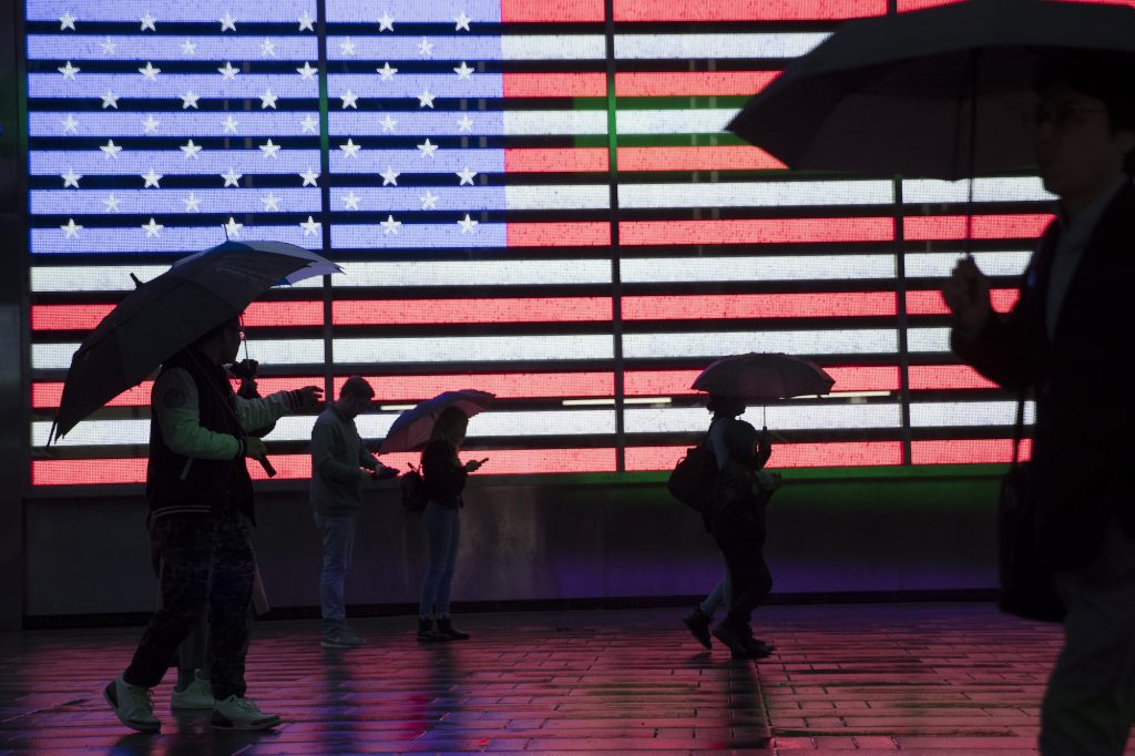Census Data Privacy Visitors to New York's Times Square use umbrellas to shield themselves against the rain