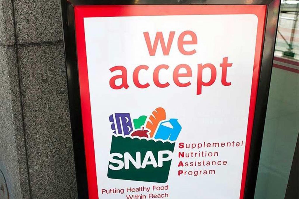 A sign indicates a store that accepts the Supplemental Nutritional Assistance Program or SNAP, the official name of the food stamp program. (File photo/The Columbus Dispatch/TNS)
