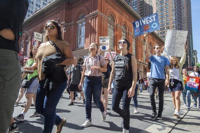 Marchers turn from Locust Street onto Broad as they head back to City Hall. (Jonathan Wilson for WHYY)
