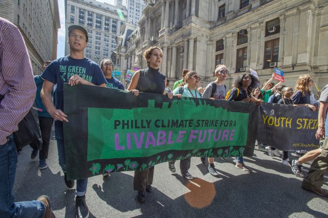Protesters march along the east side of City Hall. (Jonathan Wilson for WHYY)