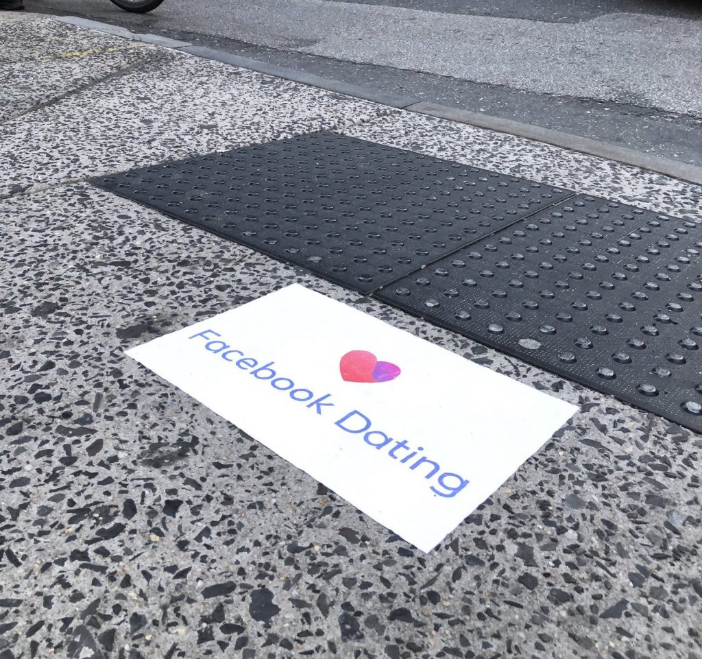 Facebook ads for the tech giant's new dating app appeared on Philly sidewalks this week. (Courtesy of Conrad Benner/Twitter)