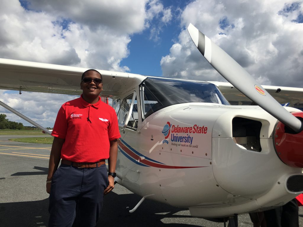 IMG_5346 Sophomore Christian Black stands next to a new Vulcanair plane that he’ll be training on at Delaware State University. (Mark Eichmann/WHYY)