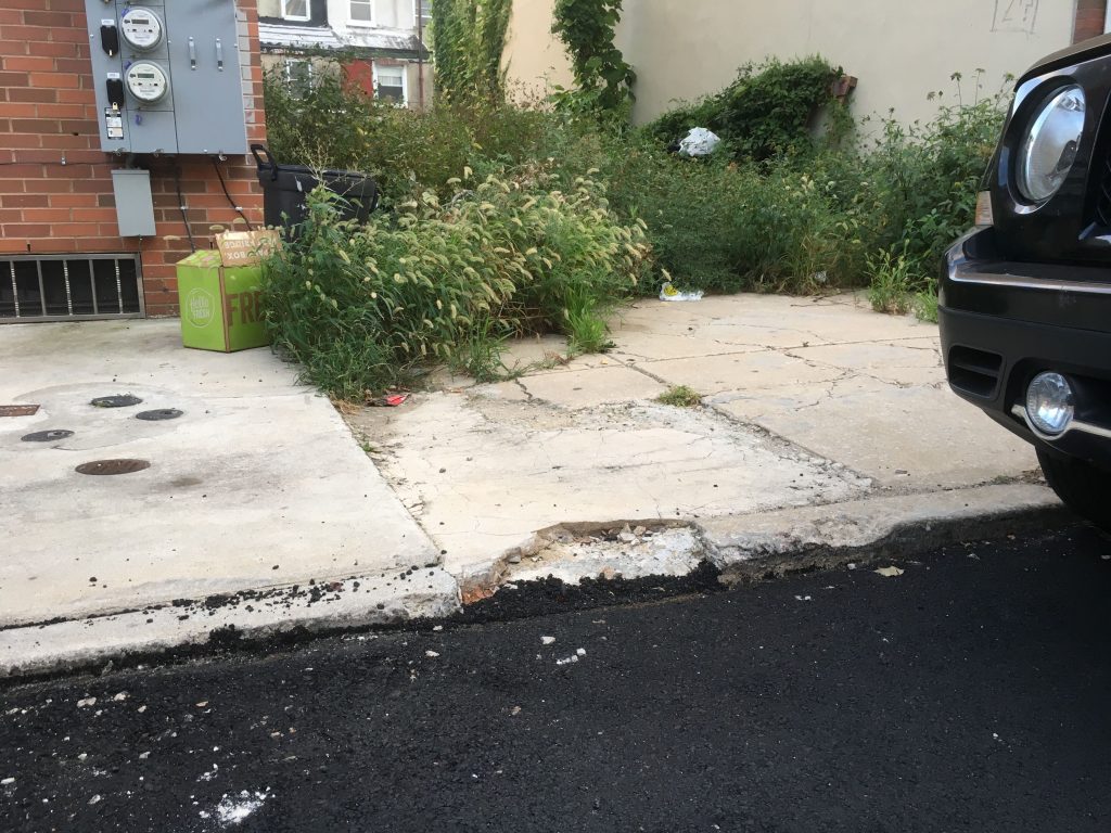 A crumbling sidewalk on Green Street near 11th (Michaela Winberg/Billy Penn)