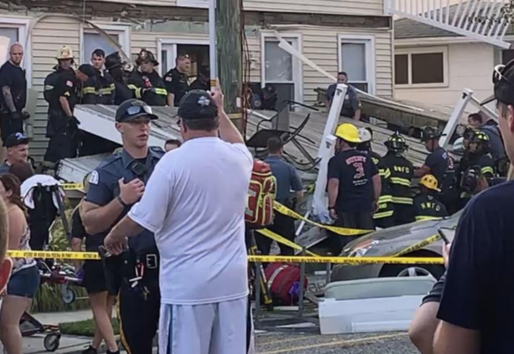 Screen Shot 2019-09-15 at 5.19.22 PM In this photo provided by James Macheda, first responders work the scene of a building structure damage in Wildwood, N.J., Saturday, Sept. 14, 2019. Multiple levels of decking attached to a building collapsed Saturday evening at the Jersey Shore, trapping people and injuring several, including children, officials and witnesses said. (James Macheda via AP)