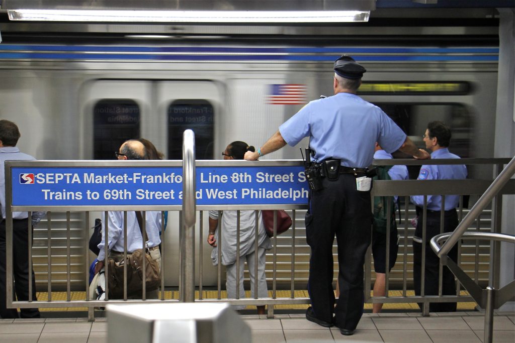 Transit police A transit police officer keeps watch on the Market-Frankford line. (Emma Lee/WHYY)