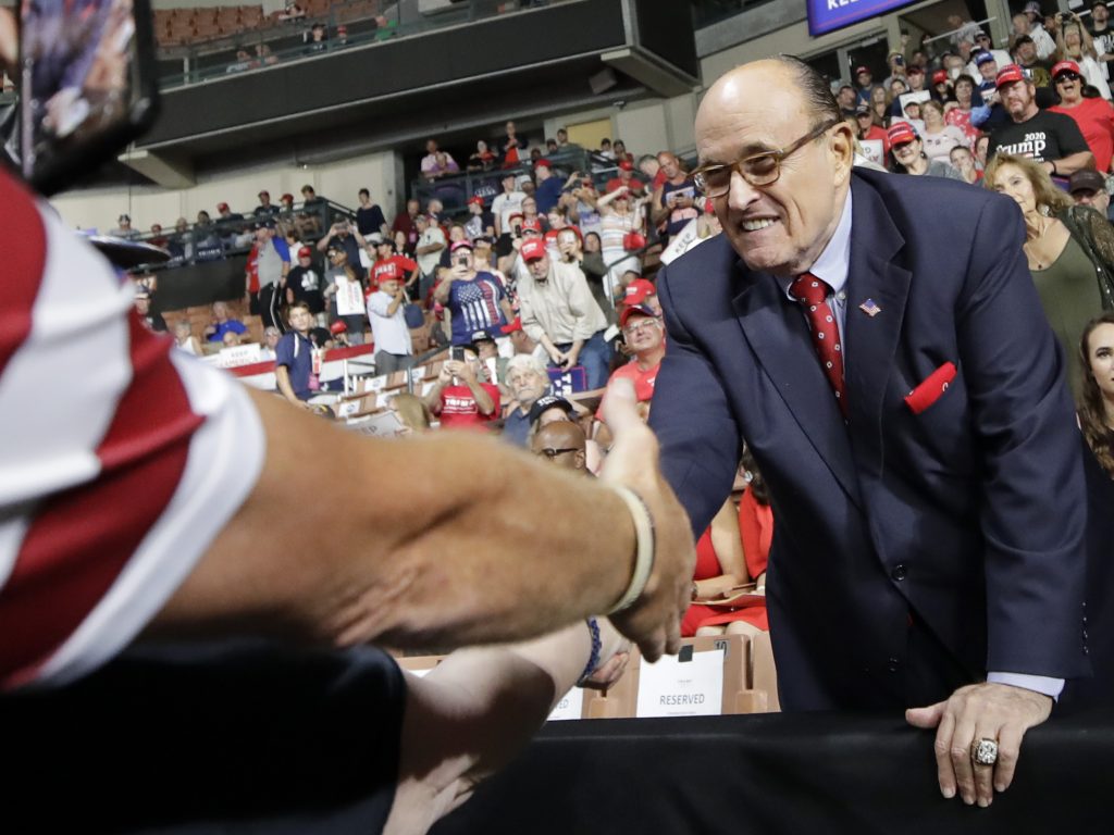 Former New York City Mayor Rudy Giuliani shook hands with supporters as he arrived at President Trump’s campaign rally on Aug. 15, 2019, in Manchester, N.H. Former New York City Mayor Rudy Giuliani shook hands with supporters as he arrived at President Trump's campaign rally on Aug. 15, 2019, in Manchester, N.H. (Elise Amendola/AP)