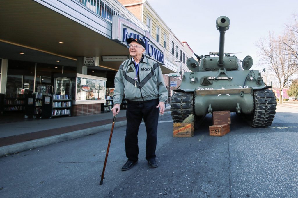 Clarence Smoyer stands outside Midtown Scholar bookstore in Harrisburg at a book signing event. (Tim Lambert/WITF)