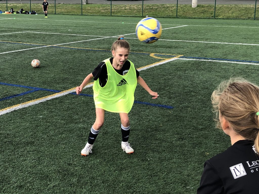 Eleven-year-old Ella Koehler, of Seattle United soccer club, heads the ball at a practice on the University of Washington campus. It’s the first year she and her teammates of the same age can use the technique. A 2015 rule by the U.S. Soccer Federation banned heading for kids ages 10 years old and younger. Eleven-year-old Ella Koehler, of Seattle United soccer club, heads the ball at a practice on the University of Washington campus. It's the first year she and her teammates of the same age can use the technique. A 2015 rule by the U.S. Soccer Federation banned heading for kids ages 10 years old and younger. (Tom Goldman/NPR)