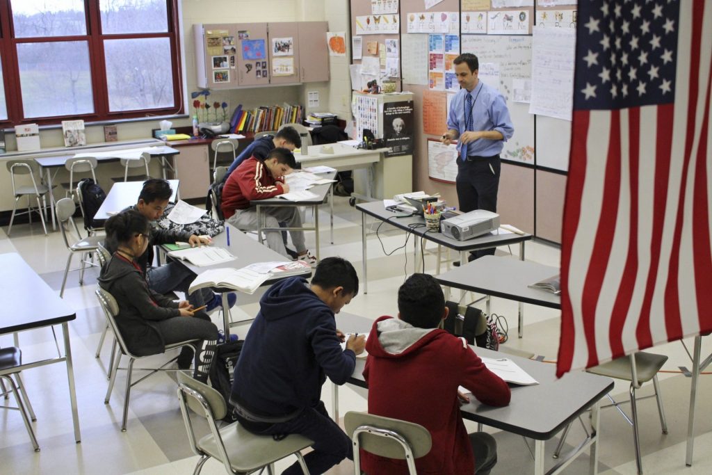 refugee_students_mckaskey-1920×1280 FILE PHOTO: In this Feb. 15, 2017, photo, Eric Hoover teaches his class of immigrant and refugee students at McCaskey High School in Lancaster, Pa. (Michael Rubinkam/AP Photo)