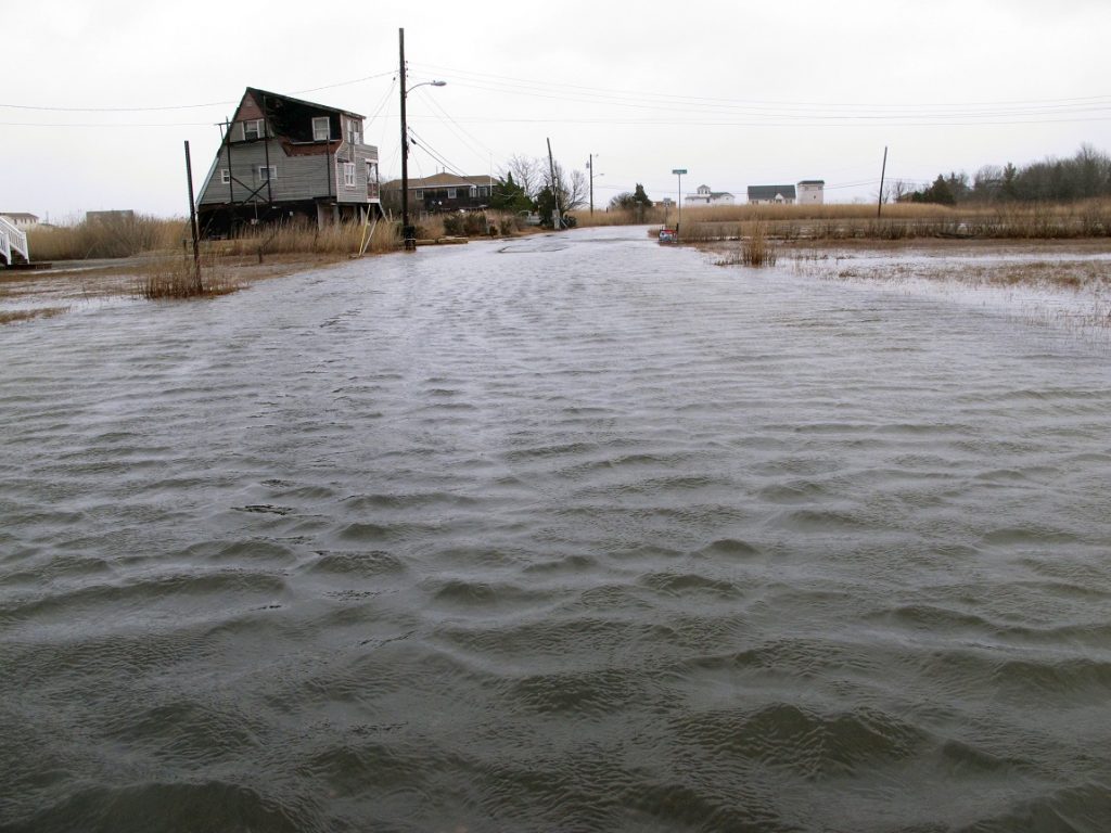 Sea Level Rise Back Bays This March 14, 2017, photo shows the flooded streets of a back bay neighborhood in Manahawkin N.J., after a moderate storm. (AP Photo/Wayne Parry)