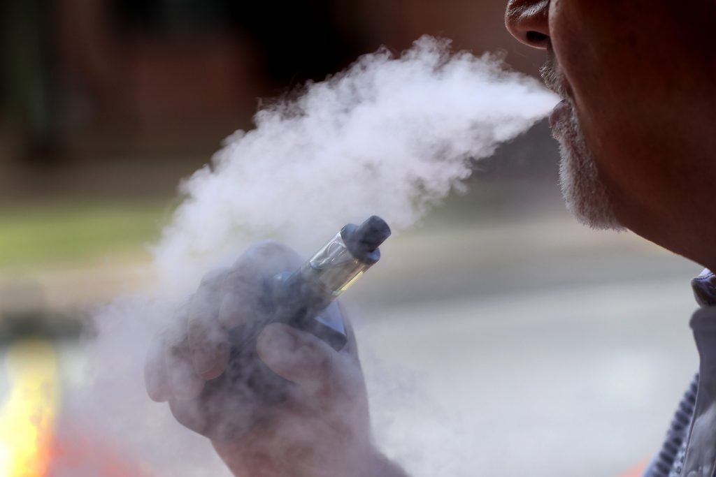 Vaping In this Aug. 28, 2019 photo a man exhales while using an e-cigarette Wednesday, in Portland, Maine. (AP Photo/Robert F. Bukaty)