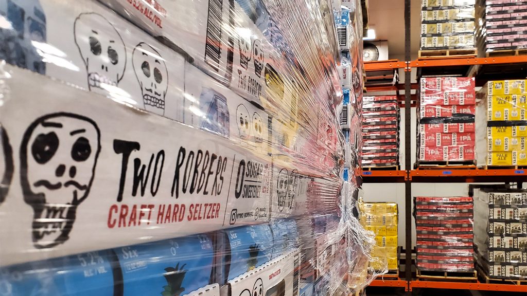 yardsbrewing-tworobbers-seltzer-03crop Stacks of Two Robbers hard seltzer in the Yards Brewing walk-in (Mark Henninger/for Billy Penn)