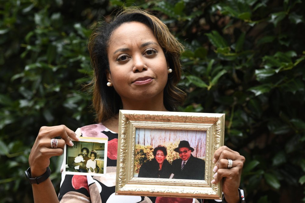 1000 (4) Donna Cryer holds up family photos that include her father Roland Henry. When her father died, she tried to donate his organs, yet the local organ collection agency said no, without talking to the family or providing a reason.