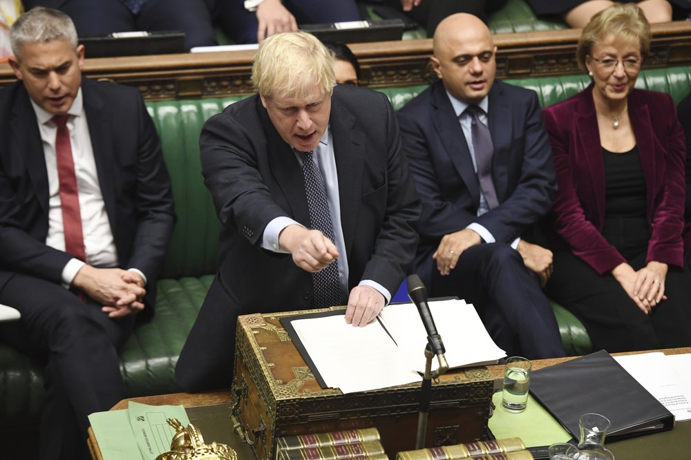 1000 Britain's Prime Minister Boris Johnson speaks to lawmakers inside the House of Commons to update details of his new Brexit deal with EU, in London. Secretary of State for Exiting the European Union, Stephen Barclay, left, and Business Secretary Andrea Leadsom, right. (Jessica Taylor/AP)