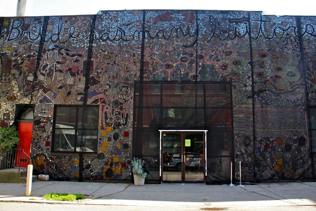 2019 05 15-e lee-philadelphia painted bride-isaiah zagar mural falling The Painted Bride Art Center is draped in black mesh since it was discovered that the Isaiah Zagar mural that covers it is separating from its walls. (Emma Lee/WHYY)