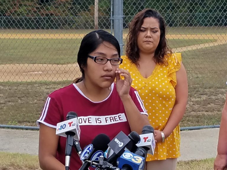 Noema Alavez Perez wipes away a tear as she talks to reporters about her missing daughter. Five-year-old Dulce Maria Alavez disappeared from Bridgeton City Park on Sept. 16. (Nicholas Pugliese/WHYY)