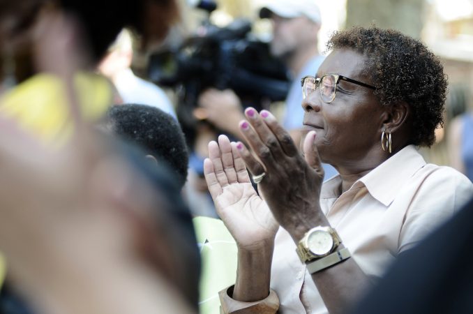 An official Pennsylvania historical marker is unveiled at the Bethel Burying Ground, located under the site of Weccacoe Playground, in Queen Village, on Tuesday. (Bastiaan Slabbers for WHYY)