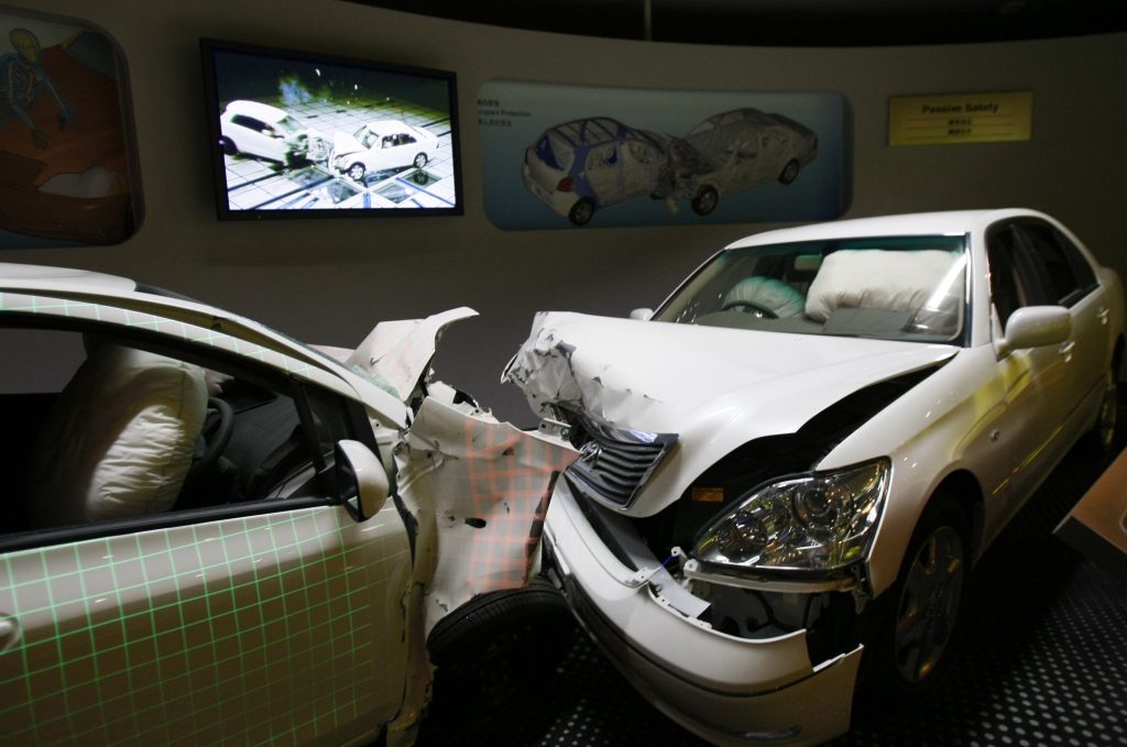 Crashed cars with airbags deployed shown at a Toyota exhibition hall in Japan. (AP/Shuji-Kajiyama) Crashed cars with airbags deployed are shown to visitors as part of the display of Toyota Motor Corp.'s safety performance standards, called