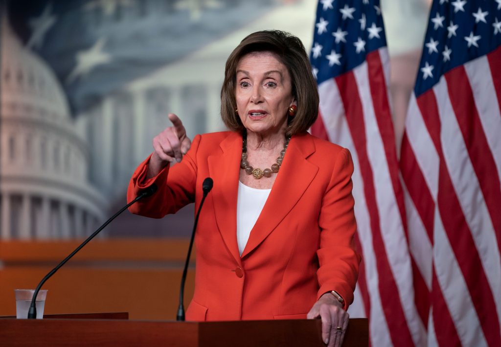 AP_19304547100852 Speaker of the House Nancy Pelosi, D-Calif., talks to reporters just before the House vote on a resolution to formalize the impeachment investigation of President Donald Trump, in Washington, Thursday, Oct. 31, 2019. (AP Photo/J. Scott Applewhite)