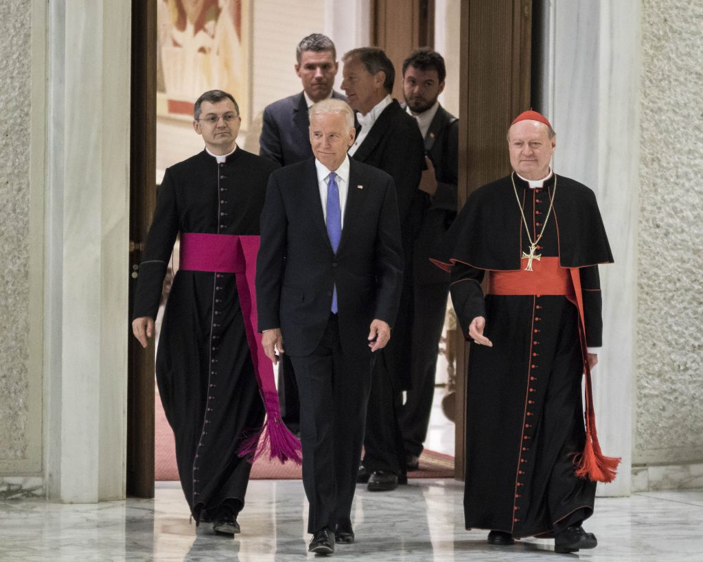 Vatican: Pope Francis and US Vice President Joe Biden In this file photo, former Vice President Joe Biden is flanked by Cardinal Gianfranco Ravasi (right) as he arrives to attend a special audience celebrates by Pope Francis with participants at a congress on the progress of regenerative medicine and its cultural impact in the Paul VI hall in Vatican City, Vatican. (Giuseppe Ciccia/Pacific Press)