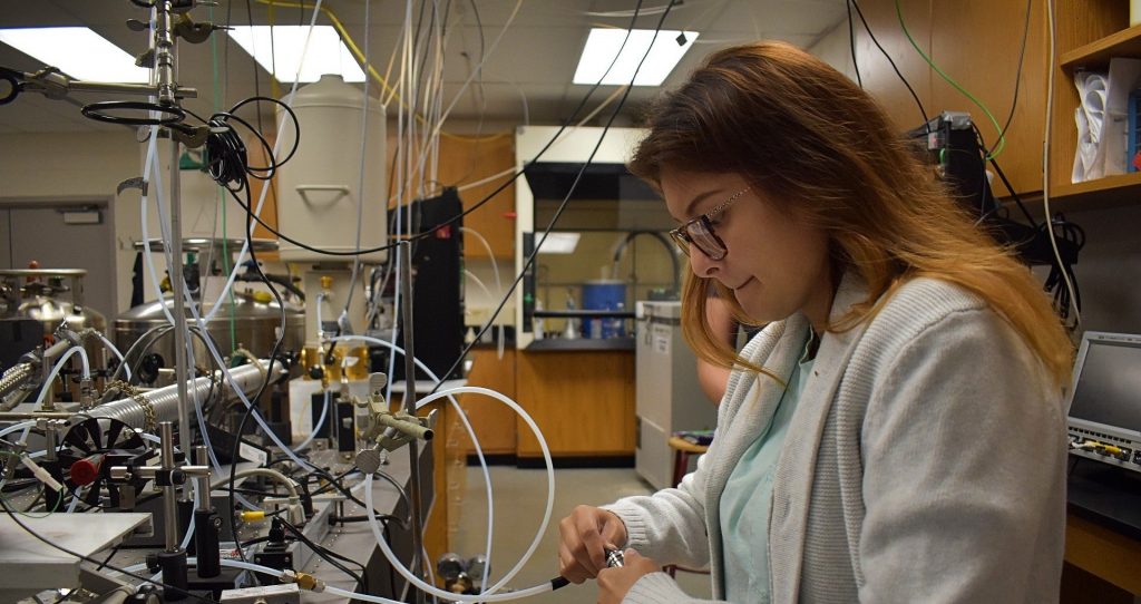 Anna-2-edited-e1571413517453-1920×1017 Buckenell chemistry senior Anna Islas connects a vaping device to a hose for testing. (Brett Sholtis/Transforming Health)