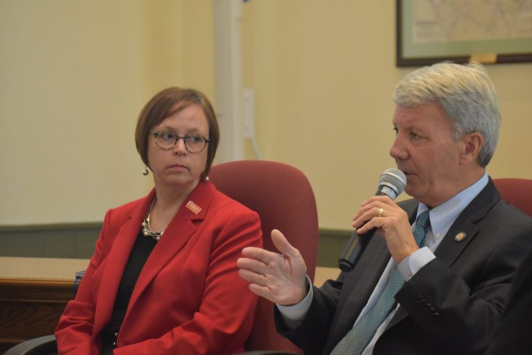 Jennifer Lugar, whose husband died by suicide with a gun in 2009, listens as state Sen. Tom Killion, R-Delaware County, speaks during a panel discussion on Oct. 1, 2019. The discussion took place at the Chadds Ford Township Municipal Building. (Ed Mahon / PA Post)