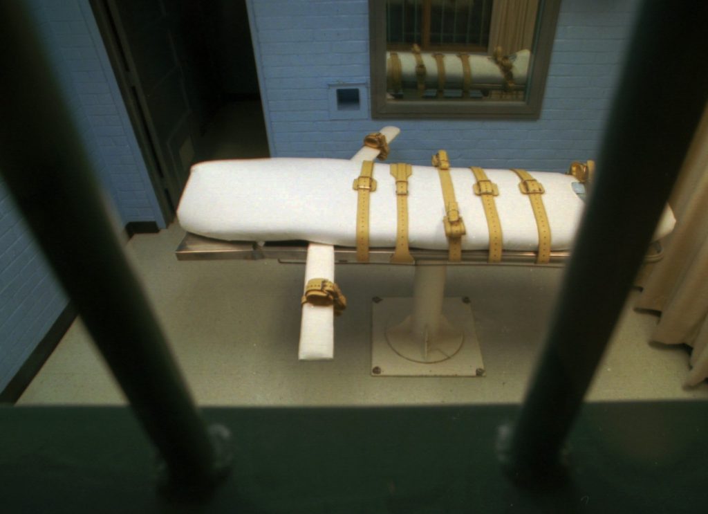 The death chamber is separated by bars, foreground, from the witness viewing room at the Walls Unit of the Texas Department of Corrections in Huntsville, Texas, in this Jan. 25, 1995 file photo.  (AP Photo/David J. Phillip, file)