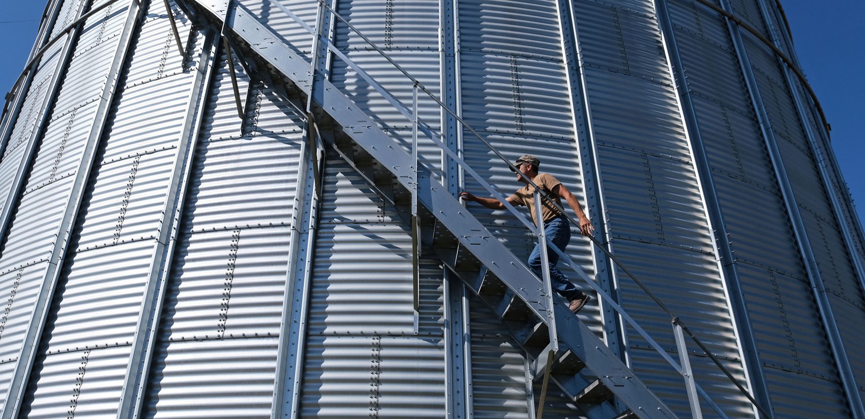 Grain farmer Don Cairns walks to the top of a grain silo Sept. 25, 2019, at Cairns Family Farm in Sadsbury Township, Pennsylvania. (Matt Smith for Keystone Crossroads)