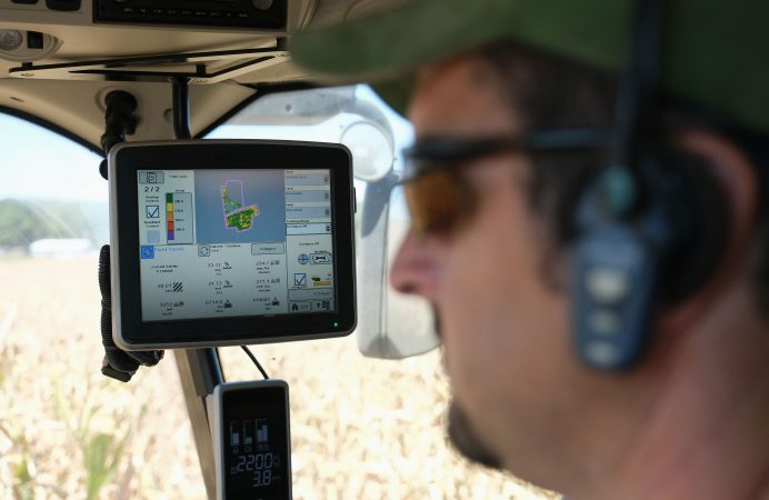 Derrick Weaver, of New Holland, drives a combine to harvest corn Sept. 25, 2019, at Cairns Family Farm in Sadsbury Township, Pennsylvania. (Matt Smith for Keystone Crossroads)