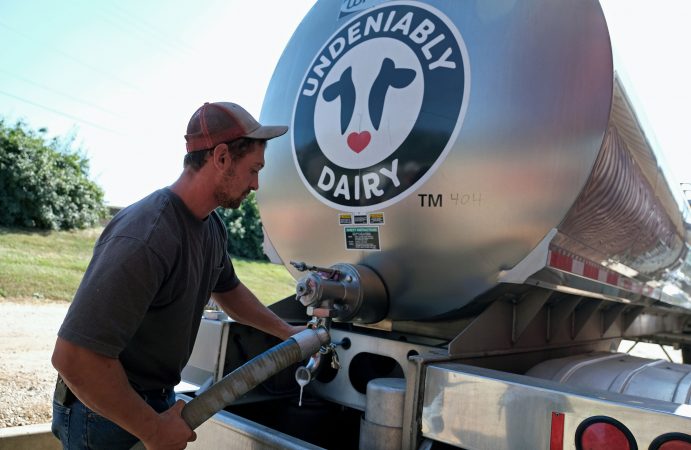 Brian Kuntzman, of Pottstown, works on filling a tanker truck with milk for delivery Sept. 25, 2019, at Ar-Joy Farms in West Fallowfield Township, Pennsylvania. (Matt Smith for Keystone Crossroads)