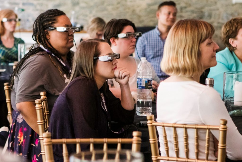 GLASSES1 People's Light staff tries on the glasses. At the right foreground is Lisa Sonneborn, director of media arts and culture at Temple University's Institute on Disabilities, one of the partners in the project to bring the Smart Caption Glasses to the United States. (Courtesy of People's Light)
