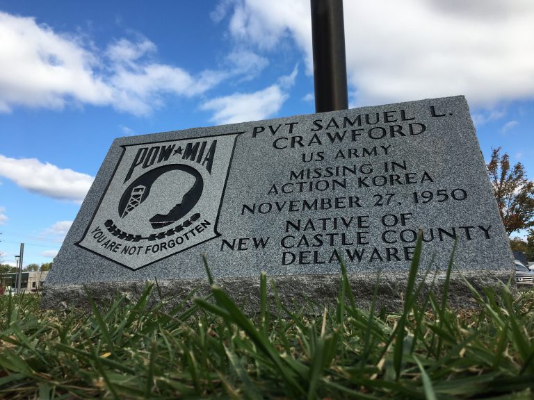 A monument outside the Route 9 Library in New Castle honors the memory of Samuel Crawford, a Wilmington soldier who went missing in action in North Korea in 1950. (Mark Eichmann/WHYY)