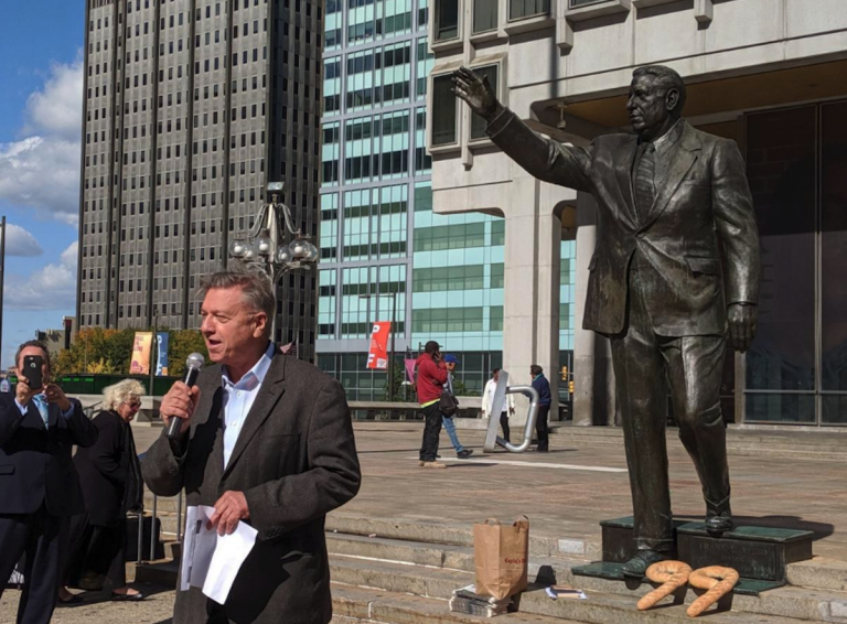 'That’s good news,' says 1210WPHT radio host Dom Giordano on Wednesday upon learning of the Kenney administration’s new schedule for removing the Frank Rizzo statue in Center City. Giordano spoke an event commemorating the 99th birthday of the former mayor, where supporters placed Italian bread loaves in the shape of the number 99 at the based of the statue. (Michael D'Onofrio/The Philadelphia Tribune)