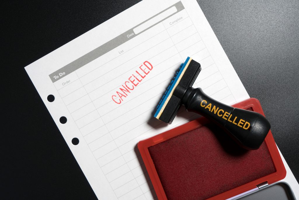 Red Stamp With Text Cancelled On To Do List Table On Business Blackground. Reminder To Cancel Busine