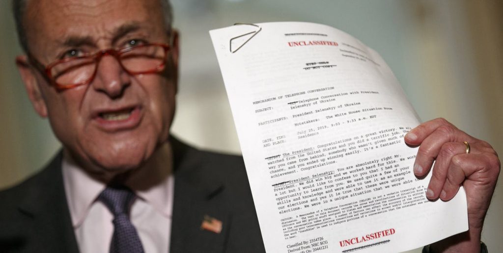 file-20191008-128661-4i2zv9 Senator Chuck Schumer holds up the White House transcript of a call between President Donald Trump and the president of Ukraine. (Jacquelyn Martin/AP Photo)