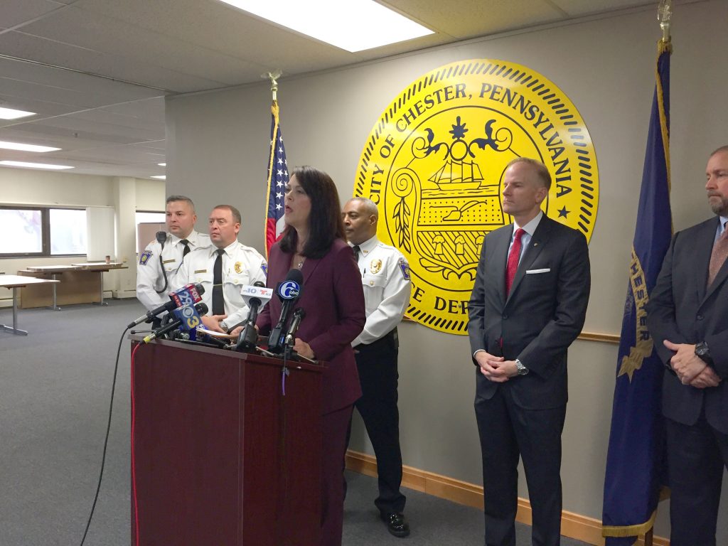 file-3 Delaware County District Attorney Katayoun Copeland (center) announces charges against 22 people, all alleged members of two Chester drug gangs. (Avi Wolfman-Arent/WHYY)