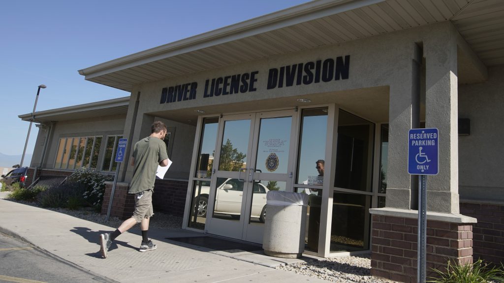 A person walks into a Utah Driver License Division office in July in Orem, Utah. A person walks into a Utah Driver License Division office in July in Orem, Utah. (George Frey/Getty Images)
