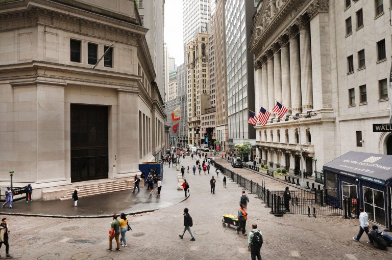 Investors are spending billions of dollars to align their portfolios with their personal values. Above, pedestrians walk past the New York Stock Exchange on June 10. (Spencer Platt/Getty Images)