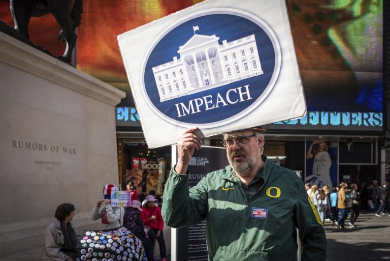 Protestors demanding that Congress impeach President Trump gather in Times Square in New York City on Sunday, October 13, 2019. (Gabriele Holtermann-Gorden/Sipa USA)(Sipa via AP Images)
