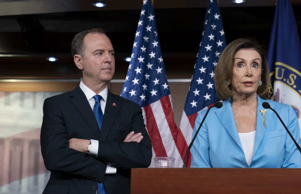 Nancy Pelosi, Adam Schiff Speaker of the House Nancy Pelosi, D-Calif., is joined by House Intelligence Committee Chairman Adam Schiff, D-Calif., at a news conference as House Democrats move ahead in the impeachment inquiry of President Donald Trump, at the Capitol in Washington, Wednesday, Oct. 2, 2019. In an unusual show of anger today, Trump defended his phone call with the president of Ukraine and said Adam Schiff may have committed treason by investigating the matter. (AP Photo/J. Scott Applewhite)