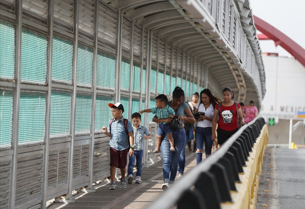 1000 (8) In this June 28, 2019 file photo, local residents with visas walk across the Puerta Mexico international bridge to enter the U.S., in Matamoros, Tamaulipas state, Mexico. (Rebecca Blackwell/AP Photo)