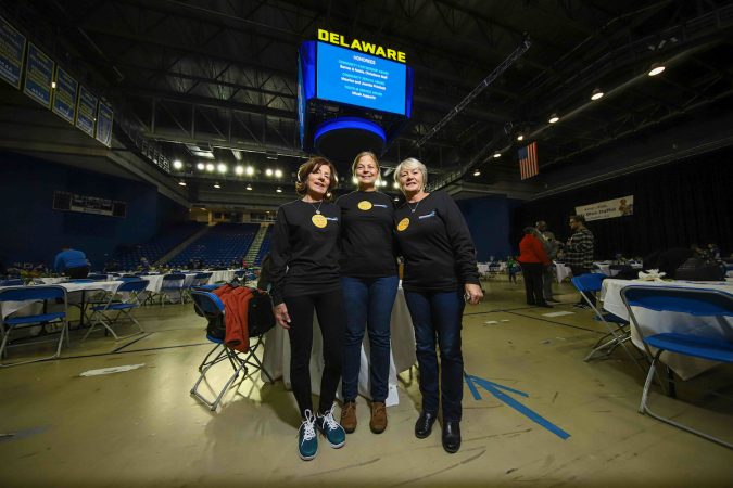 Volunteers (from left) Linda Jones, Marie Cantrell and Breda Buckley pose together for a photo during Kind to Kids Foundation’s 4th Annual My Blue Duffel Community Service Day Sunday. (Saquan Stimpson for WHYY)