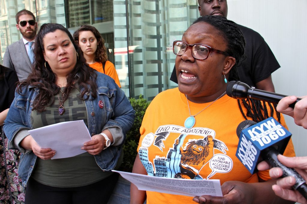2019 04 18-e lee-erika almiron kendra brooks-philadelphia city hall-tax abatement protest Kendra Brooks (right), Working Families Party candidate for City Council, joins members of 215 People's Alliance in calling for an end to the city's tax abatement program. (Emma Lee/WHYY)