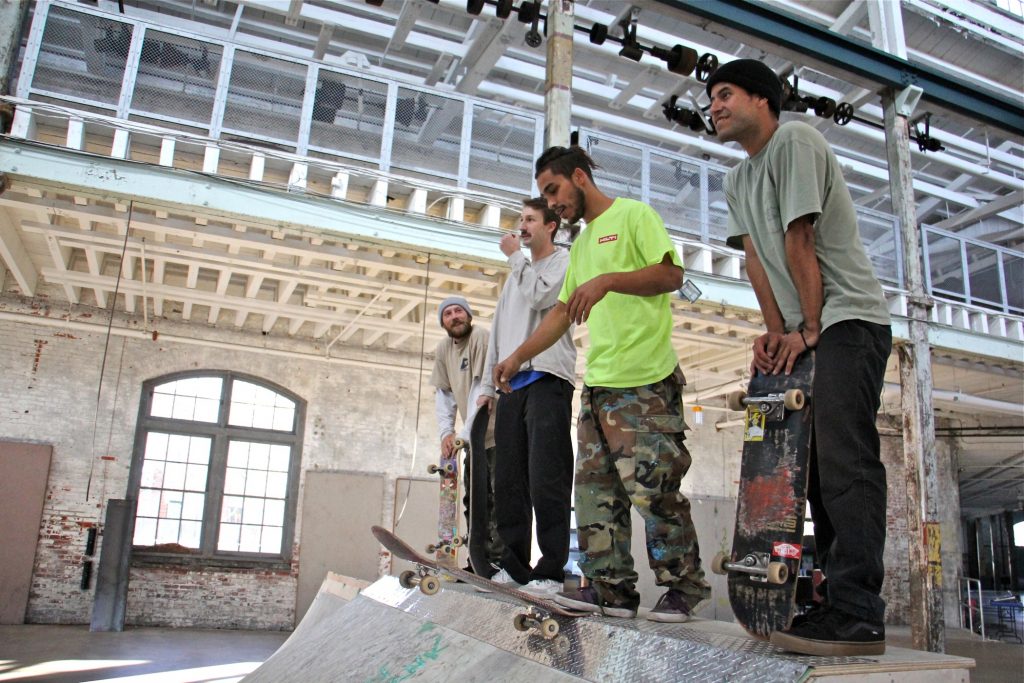 2019 11 01-e lee-trenton freedom skate park Taking a break from assembling ramps and rails, skaters (from left) Tyler Nelson, Jake McNichol, TJ Hernandez Jr., and Enrique Herrera prepare to show off their skills. (Emma Lee/WHYY)